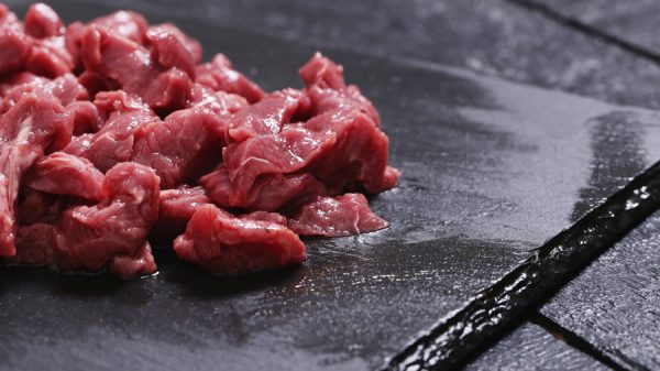 Fresh meat on a black cutting board